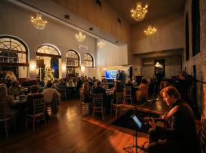 Grand open ballroom with high ceilings and brick facade at Old Post Office wedding & event venue in Bainbridge
